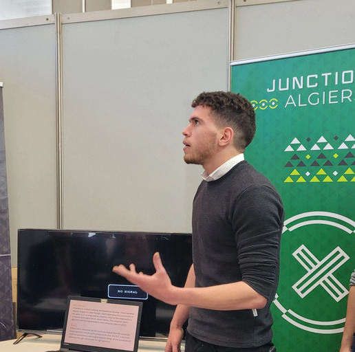 Usuual founder Moustafa picture doing presentation at a hackathon